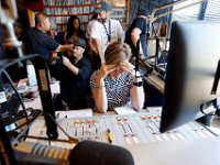 Surrounded by current and former DJ's, WUMD station manager, Jennifer Mulcare-Sullivan, is overcome with emotion as she signs off for the last time over the air as the station transitions to an online only broadcast.  The University of Massachusetts Dartmouth radio station, WUMD, stopped broadcasting over the airwaves after 42 continuous years.   It will now continue to broadcast strictly over the internet at www.umd.rocks   [ PETER PEREIRA/THE STANDARD-TIMES/SCMG ]